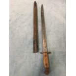 A 1907 pattern steel bayonet by Wilkinson, the channelled steel blade with riveted hardwood