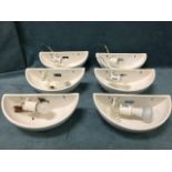 A set of six crescent shaped ceramic upligters with fittings & bulbs. (11.5in) (6)