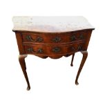 A nineteenth century mahogany side table with shaped bowfronted top above two cockbeaded drawers and