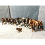 A collection of ceramic shire horses with leather/vinyl tack, and brass & metal mounts & chains -