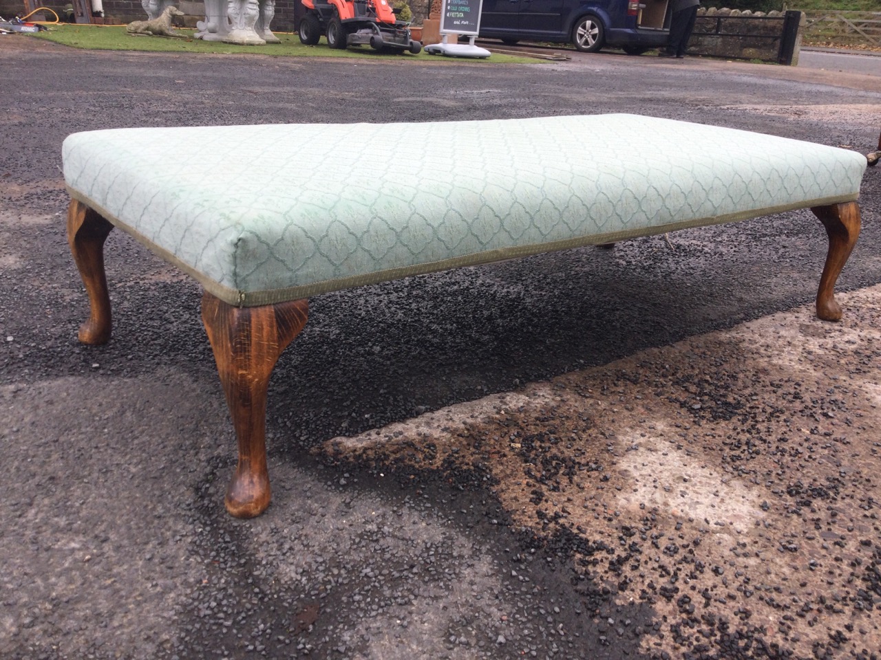 A rectangular upholstered low stool, the seat raised on stained cabriole legs. (48.5in x 23.25in x - Image 2 of 3