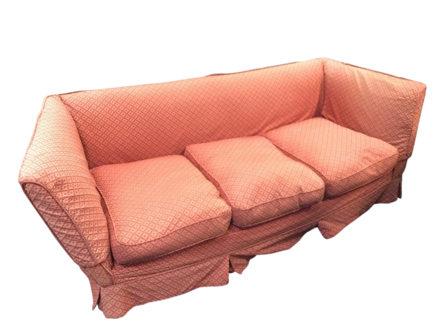 An Edwardian knole style sofa, the straight back flanked by flared arms above a sprung seat with