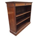 A late Victorian mahogany open bookcase, the rectangular top with moulded cornice above a panelled