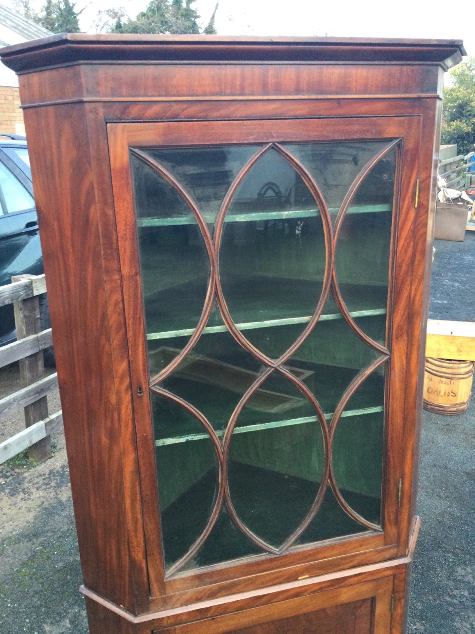 A nineteenth century mahogany corner cabinet with moulded cornice above an astragal glazed door - Image 3 of 3