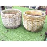 A pair of octagonal composition stone garden plant pots by Cotswold Studios, the tubs embossed