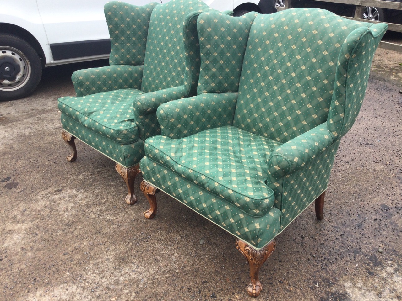 A pair of upholstered Georgian style wing-back armchairs, the wide sprung seats with loose cushions, - Image 2 of 3