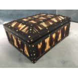 A rectangular Edwardian porcupine quill box with panelled hinged lid, the frame inlaid with bone