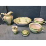 An art nouveau Staffordshire wash set embossed with pink flowers on pale green ground - jug,