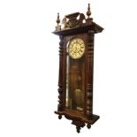 A large Victorian Vienna wallclock with Gustav Becker movement, the walnut case with shell