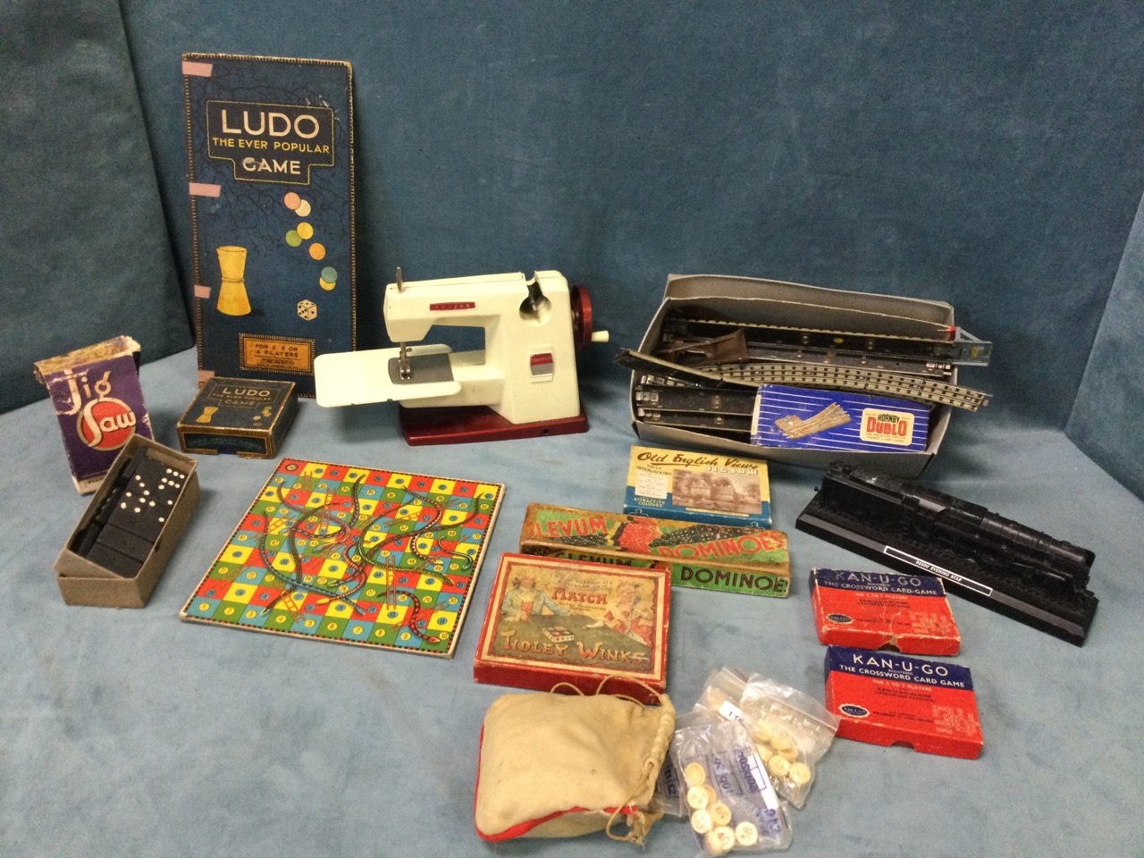 Miscellaneous childrens items including a box of Hornby dublo railtrack, a toy Vulcan sewing