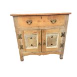 A Victorian pine side cabinet with rectangular top above a frieze drawer and cupboards with panels