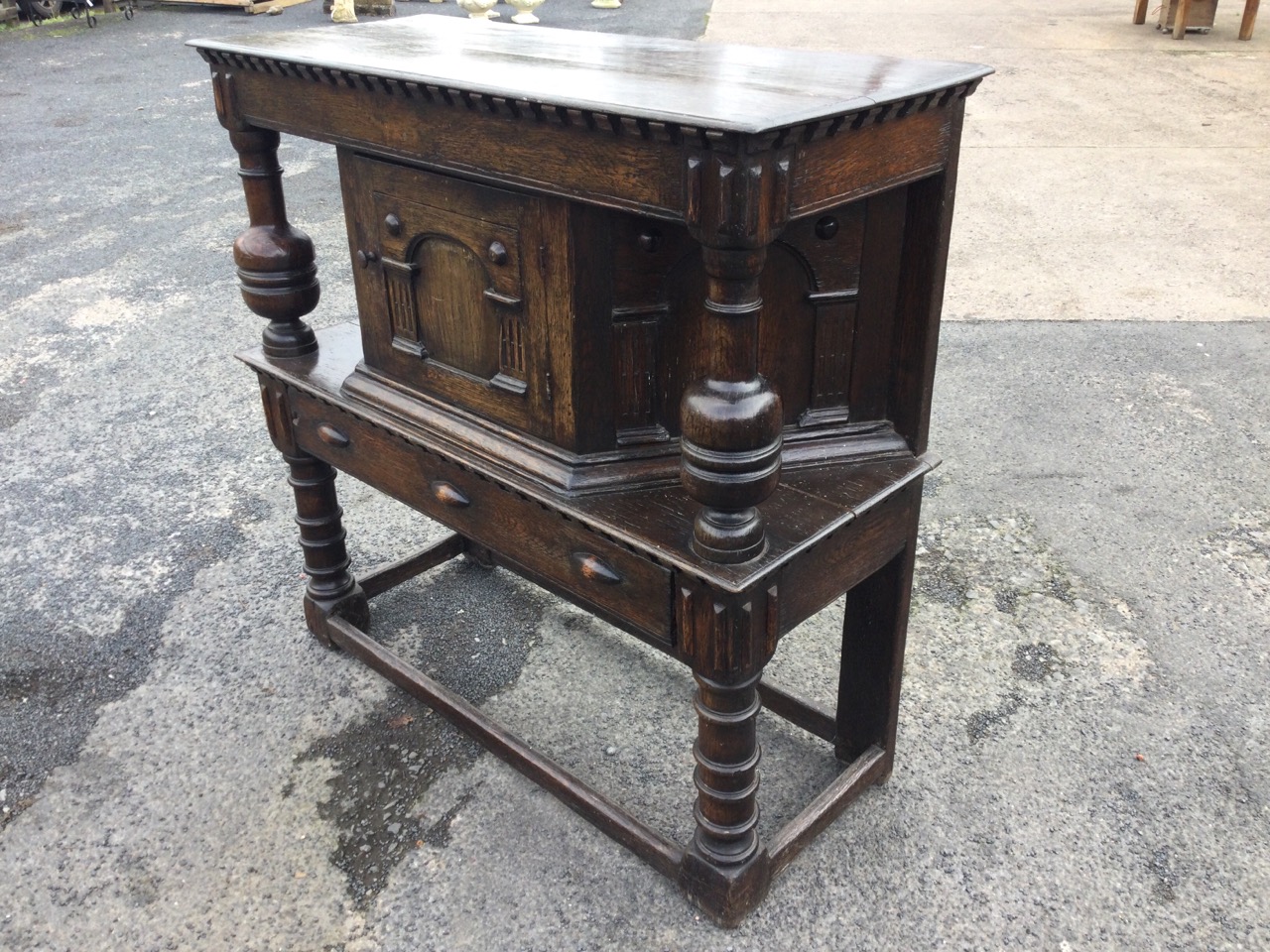 An oak court cupboard, the rectangular top with dentils supported on bollection turned columns - Image 3 of 3