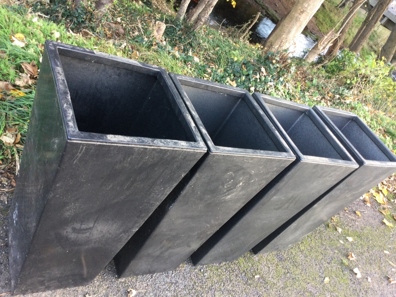 A set of four large resin moulded charcoal coloured square tapering garden tubs. (15.75in x 15. - Image 3 of 3