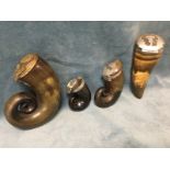 Three early nineteenth century scrolled horn snuff mulls with hinged lids and silver mounts; and