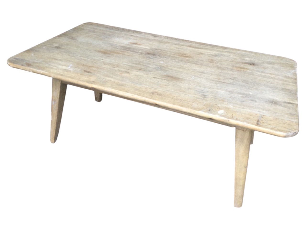 A Loaf oak coffee table with rectangular top on rounded tapering angled legs. (43.25in x 23.5in x