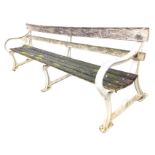 An 8ft Edwardian garden bench on three heavy cast iron supports by Spencer Heath & George Ponders,