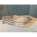 A set of 9 Spear & Jackson machetes with shaped ribbed Sheffield steel blades and riveted hardwood