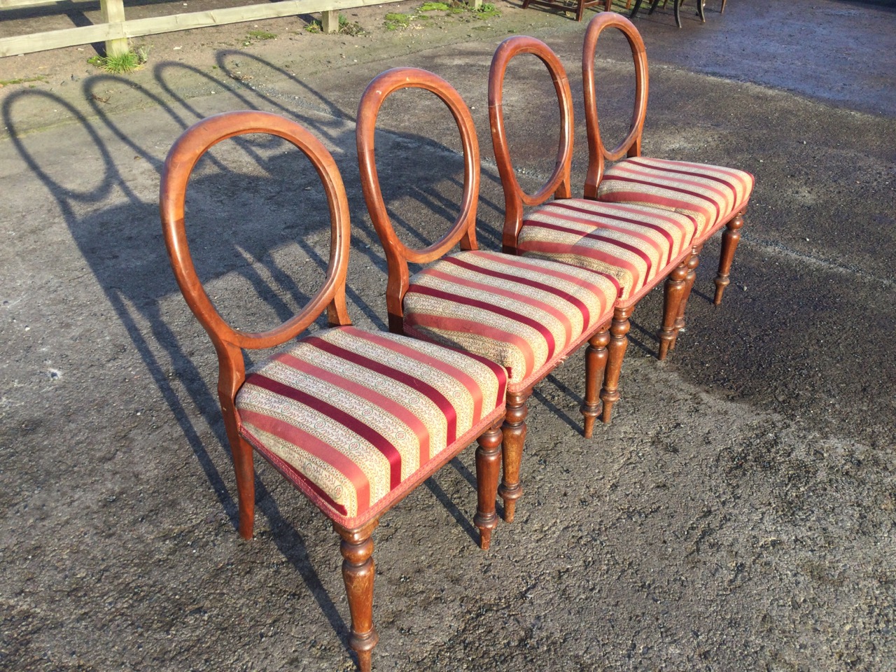 A set of four Victorian mahogany balloon-back dining chairs with stuffover upholstered seats - Image 3 of 3