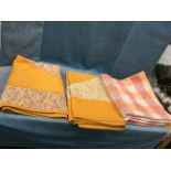 A pair of rectangular C20th cotton quilts sewn with paisley printed panels and borders on orange