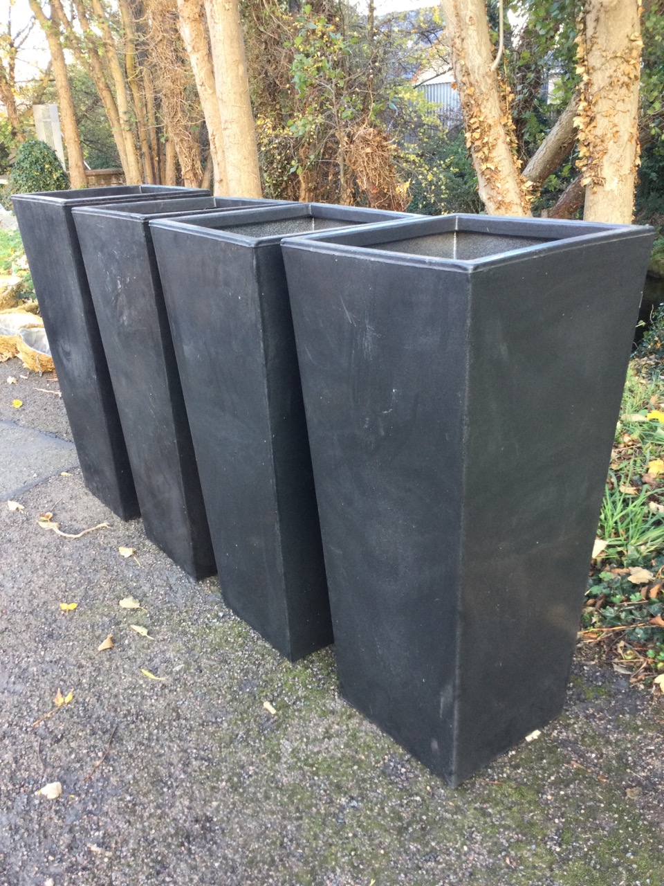 A set of four large resin moulded charcoal coloured square tapering garden tubs. (15.75in x 15. - Image 2 of 3