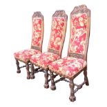 A set of three Victorian carved oak side chairs, the high backs with acanthus scrolling framing