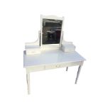 A painted Victorian mahogany dressing table, the mirror in ribbed frame above two platforms with