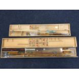 A boxed Japanese four-piece fishing rod set with flies, casts, etc; and another similar cased set