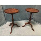 A pair of Chapman/Siesta mahogany wine tables with scalloped circular tray tops on turned fluted