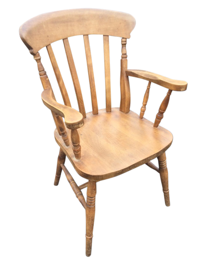 A lathe-back farmhouse armchair with shaped arms on spindles above a solid seat, raised on turned