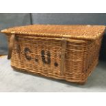 A rectangular cane hamper with leather straps, raised on battens. (31in x 21.5in x 15in)