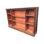 An Edwardian 6ft mahogany breakfront open bookcase with adjustable shelves, having rectangular