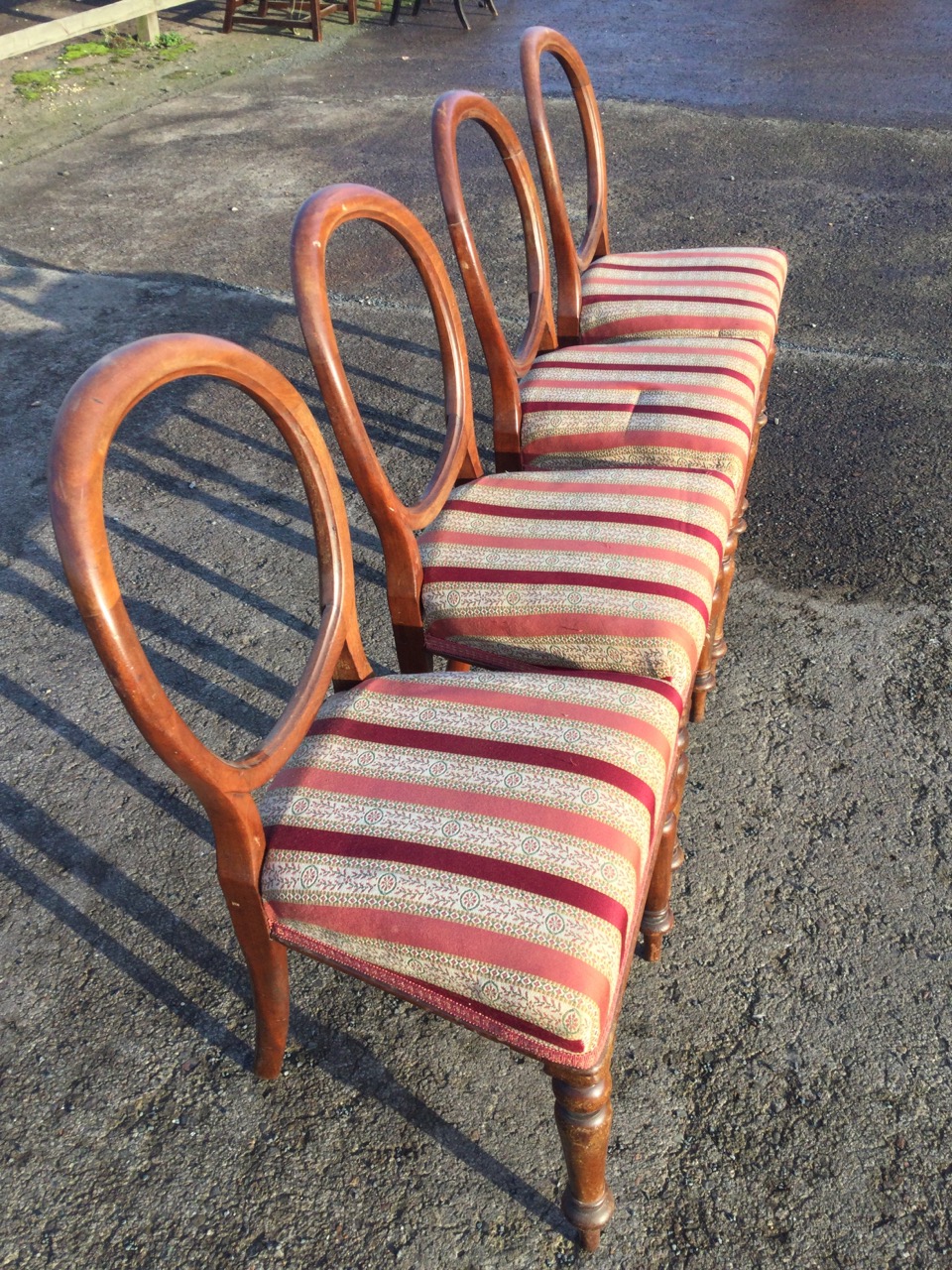 A set of four Victorian mahogany balloon-back dining chairs with stuffover upholstered seats - Image 2 of 3