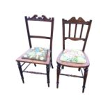 A Victorian chair with scroll carved back rail above a floral needlework seat - formerly caned,