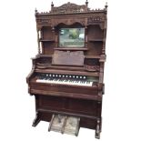 A Victorian walnut cased harmonium with Crane & Rose Ltd, Liverpool retail label, the back foliate