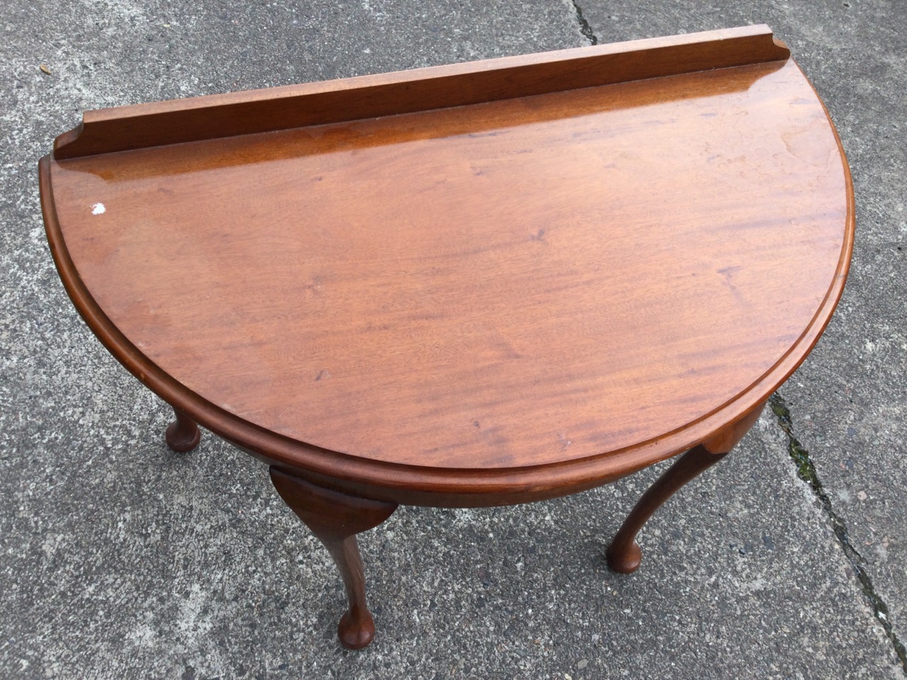 A D-shaped mahogany side table with moulded top above a plain apron, raised on cabriole legs with - Image 2 of 3