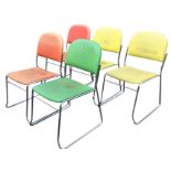 A set of five 70s chrome framed dining chairs in coloured vinyl upholstery, with arched padded backs
