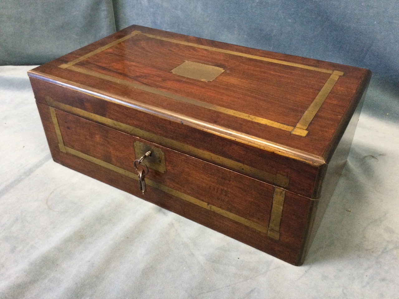 A nineteenth mahogany brass bound writing box, the slope with gilt tooled leather skiver, pen tray