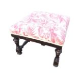 A square nineteenth century upholstered stool with later pink floral printed linen upholstery,