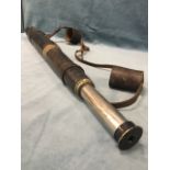 A large nineteenth century leather mounted brass telescope, with sliding eyepiece tube - numbered