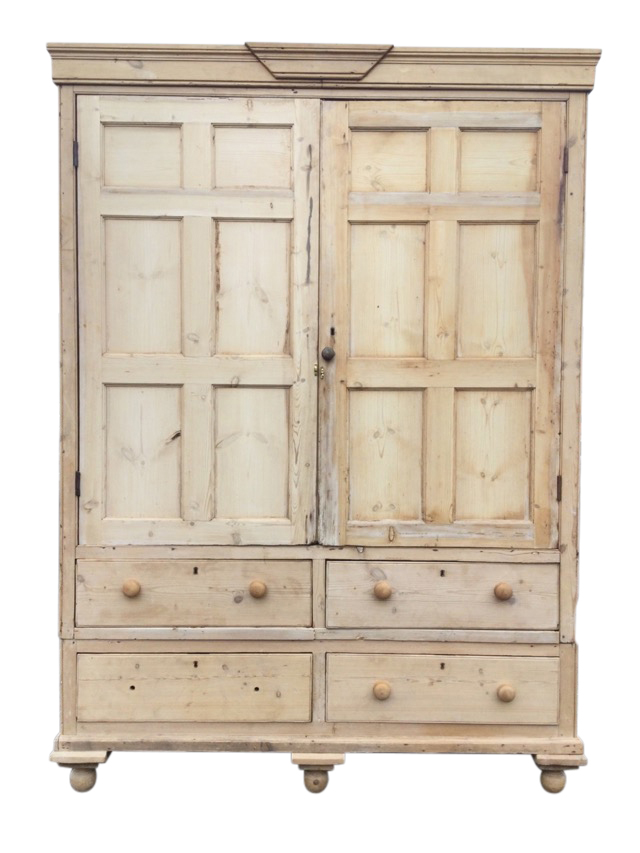 A large Victorian pine housekeepers cupboard, the cornice with applied central moulding above