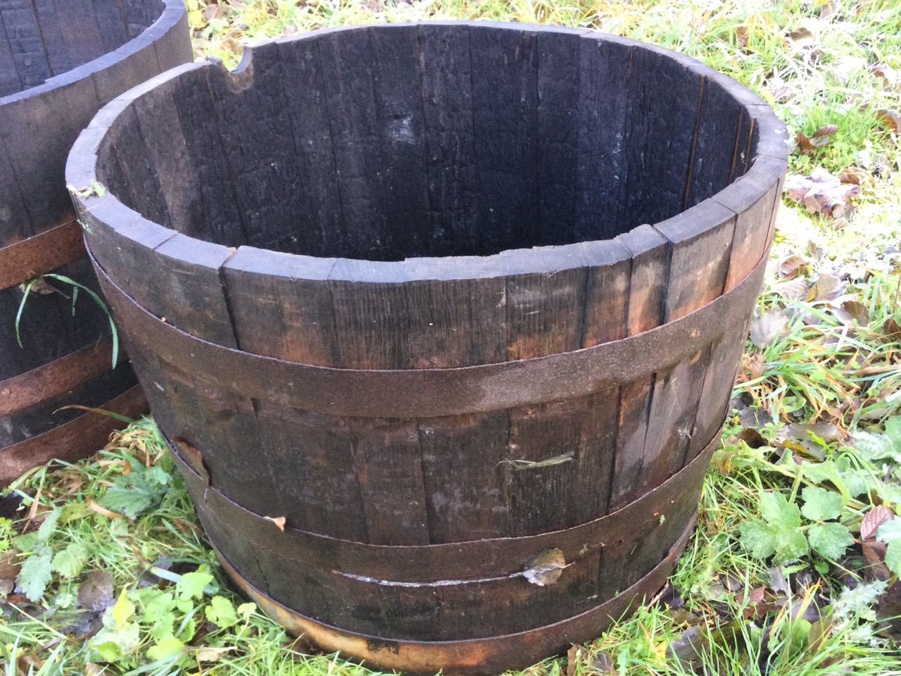 A graduated pair of oak garden barrel tubs, the staves bound by riveted metal strap bands. (24in & - Image 3 of 3