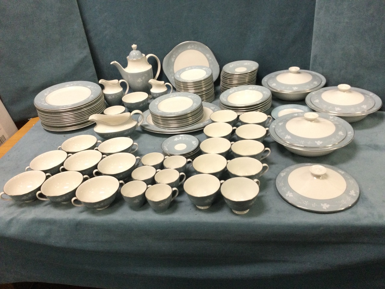 A Royal Doulton dinner and tea service decorated in the gray Reflection pattern with plates,