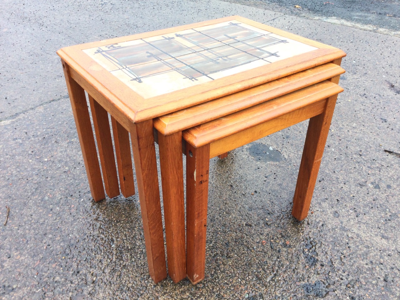 A nest of 70s Danish teak tables with art studio pottery tiles to rectangular moulded tops, raised - Image 2 of 3