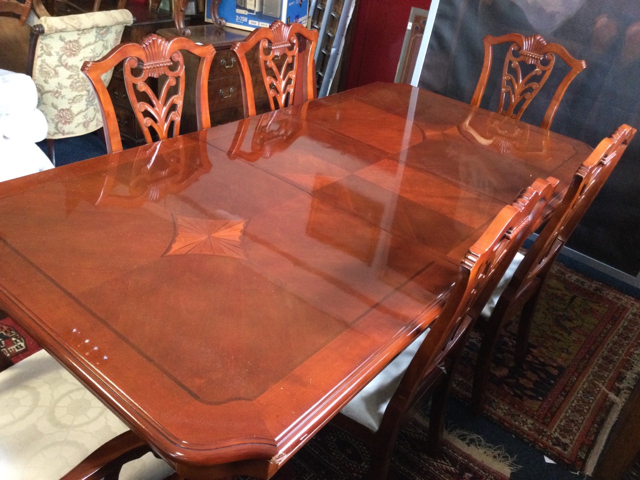 A reproduction mahogany dining suite, the table with crossbanded cut-corner parquetry top above a - Image 3 of 3