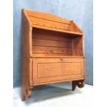 A late Victorian pitch pine set of shelves with chamfered and applied roundel decoration, the bottom