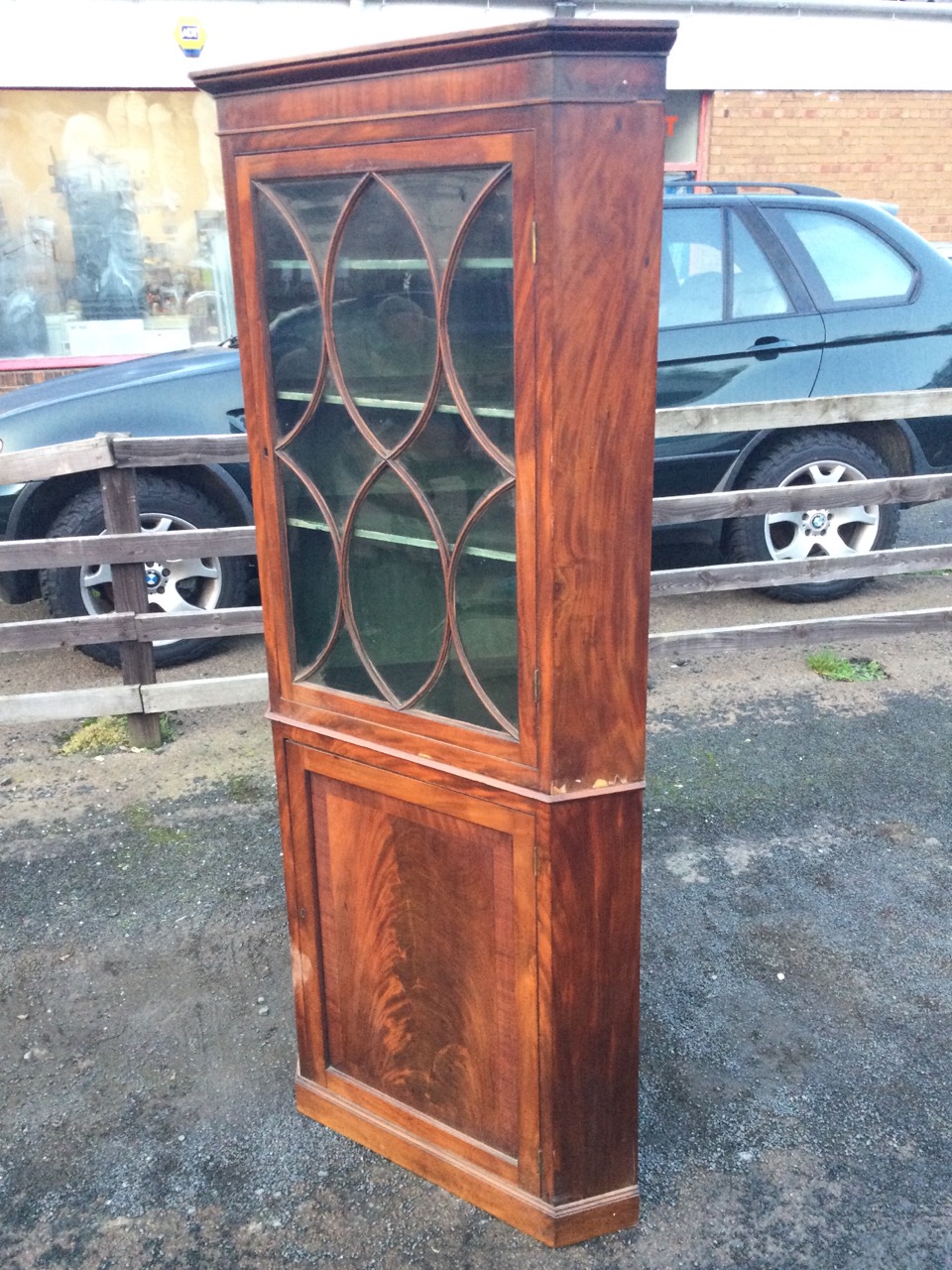 A nineteenth century mahogany corner cabinet with moulded cornice above an astragal glazed door - Image 2 of 3