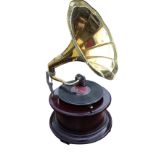 A reproduction gramophone in circular moulded case bearing label - Victrola, the working wind-up