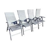 A set of four folding garden armchairs with fabric backs & seats and rectangular arms, the chairs