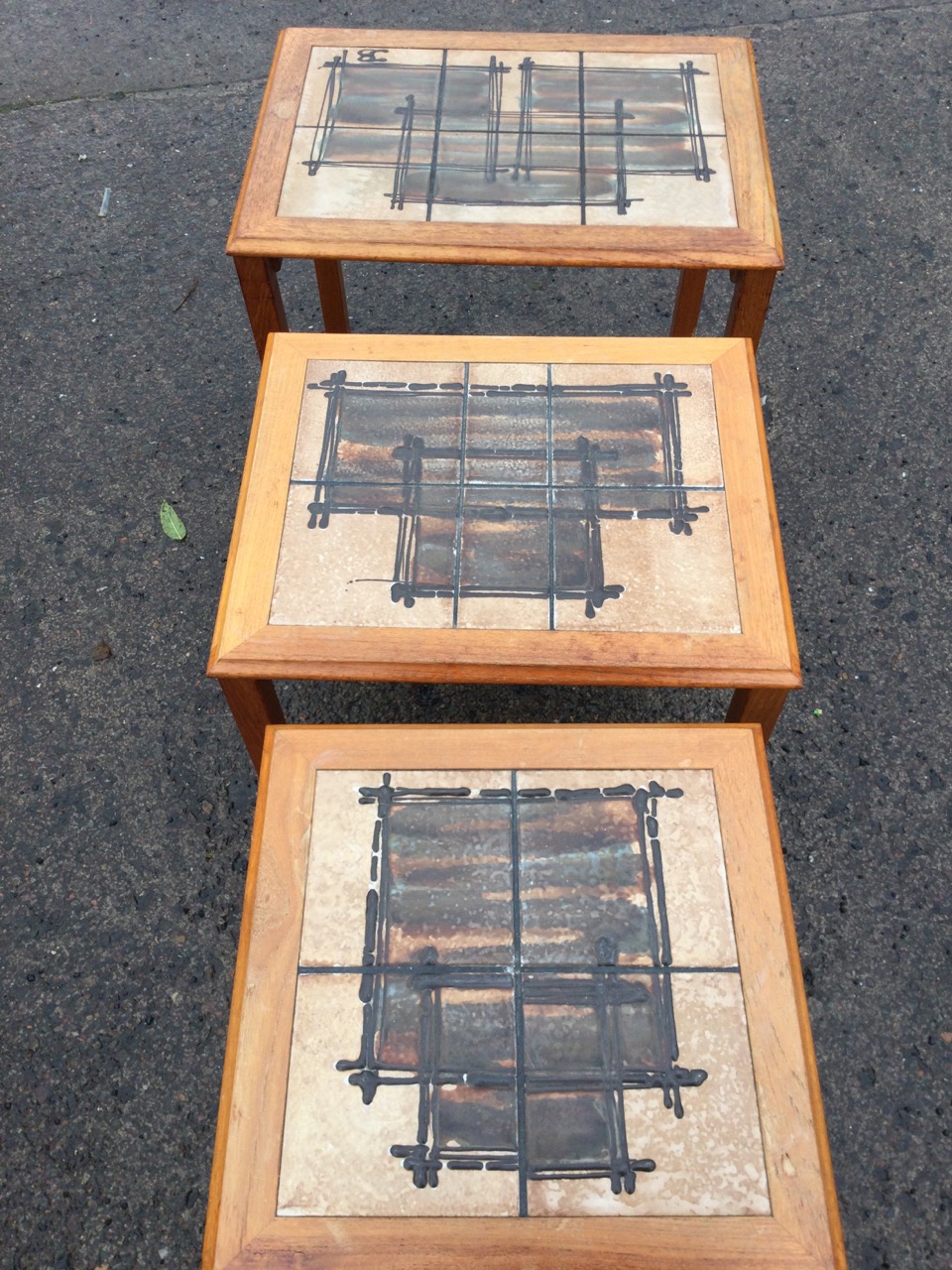 A nest of 70s Danish teak tables with art studio pottery tiles to rectangular moulded tops, raised - Image 3 of 3