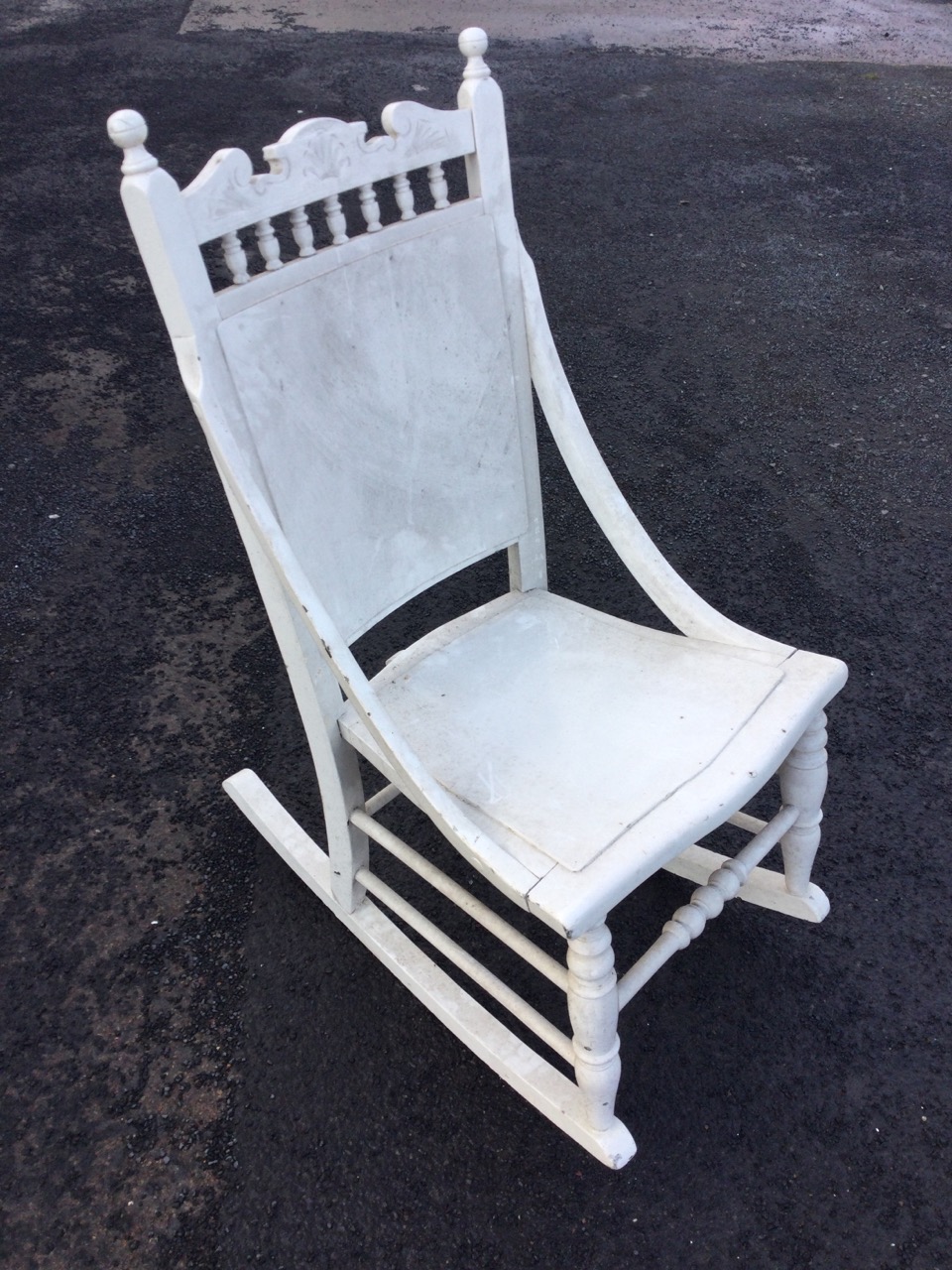 A late nineteenth century painted rocking chair with spindle gallery to back beneath a carved - Image 3 of 3